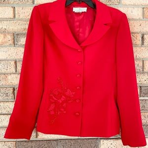 Women’s red suit. Blazer and skirt.
